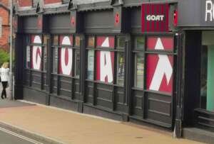 Wide Side Shot of GOAT Window Signage. Printed & Installed by Johnsons Printers